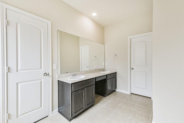 12638 Silver Winter Trl, Houston, TX 77014 - bathroom with double vanity, tile patterned flooring, and baseboards