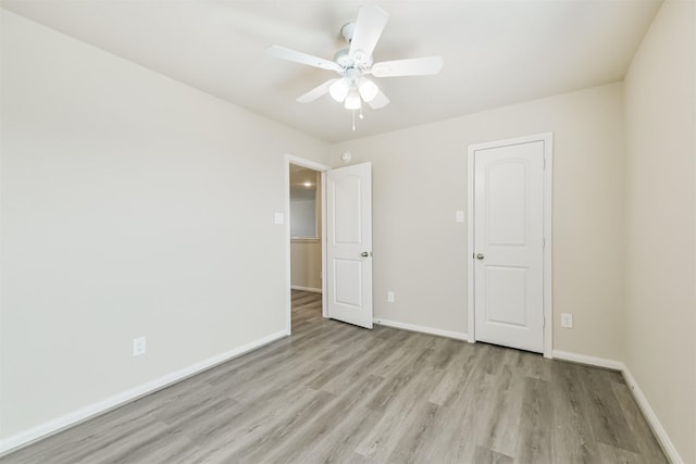 12638 Silver Winter Trl, Houston, TX 77014 - unfurnished bedroom featuring light wood-style flooring, baseboards, and a ceiling fan