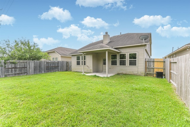 12638 Silver Winter Trl, Houston, TX 77014 - back of house with a chimney and a patio area