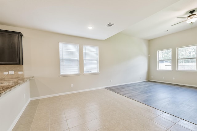 12638 Silver Winter Trl, Houston, TX 77014 - spare room featuring a ceiling fan, light tile patterned flooring, baseboards, and recessed lighting
