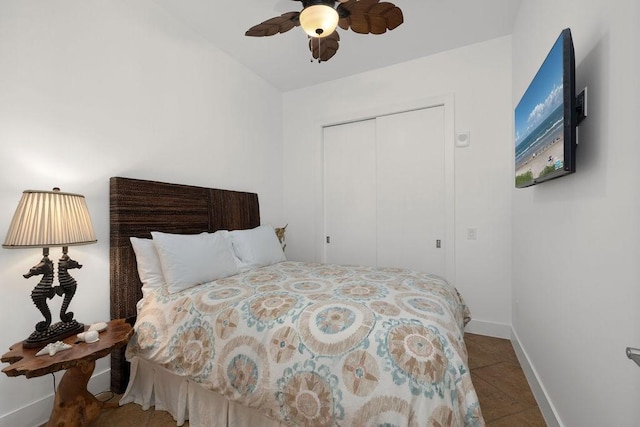 310 Padre Blvd Unit 2305, South Padre Island, TX 78597 - bedroom featuring a closet, baseboards, tile patterned floors, and ceiling fan