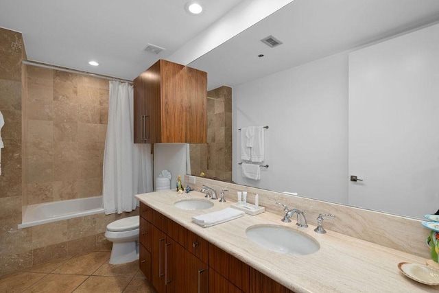 310 Padre Blvd Unit 2305, South Padre Island, TX 78597 - bathroom featuring toilet, tiled shower / bath, recessed lighting, double vanity, and tile patterned flooring