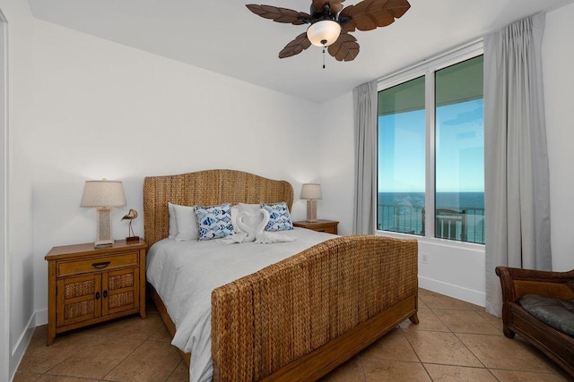 310 Padre Blvd Unit 2305, South Padre Island, TX 78597 - tiled bedroom with baseboards and a ceiling fan