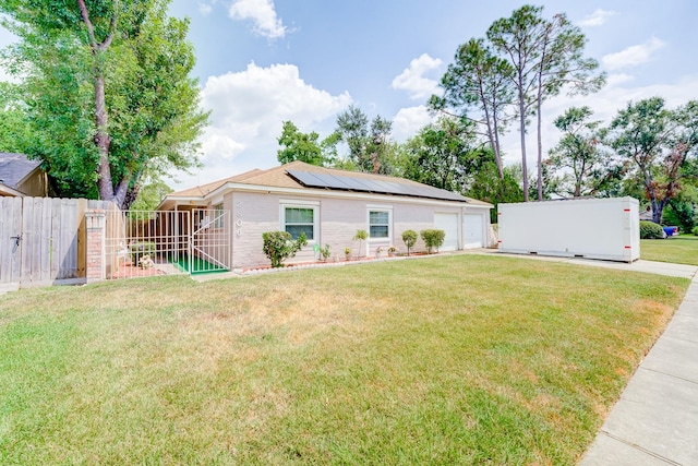 2806 Quail Valley E Dr, Missouri City, TX 77489 - ranch-style house with solar panels, an attached garage, driveway, and a gate