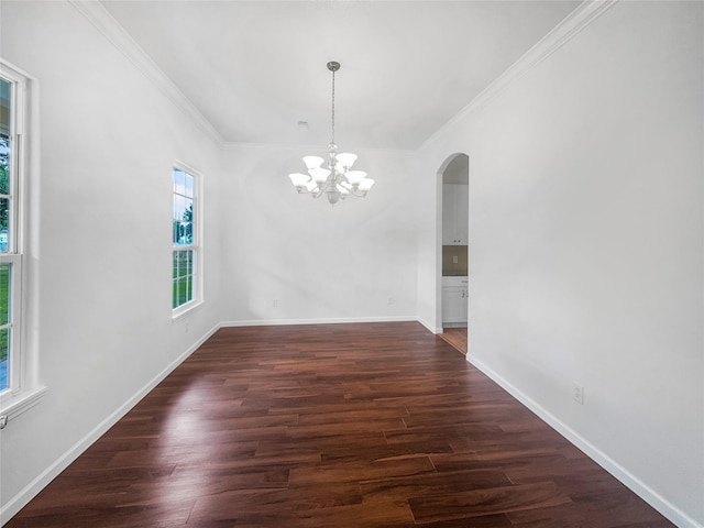 2424 Katy Hockley Cut Off Rd, Katy, TX 77493 - unfurnished dining area with arched walkways, ornamental molding, a chandelier, dark wood finished floors, and baseboards