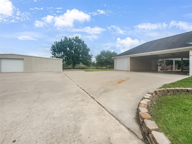 2424 Katy Hockley Cut Off Rd, Katy, TX 77493 - view of property exterior featuring an outbuilding and a garage