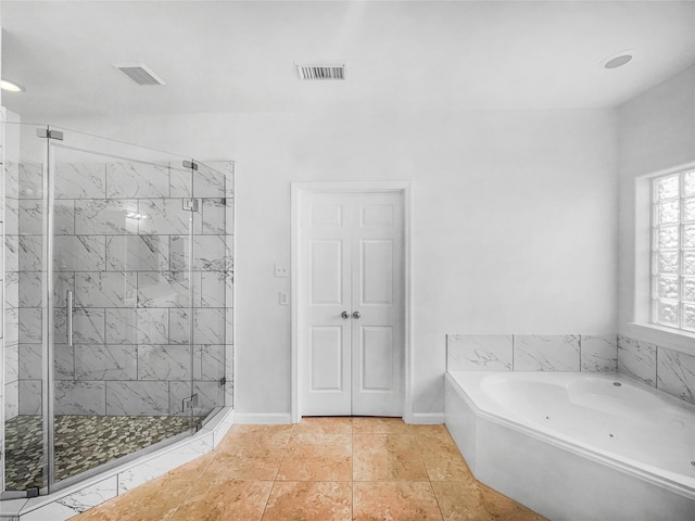 2424 Katy Hockley Cut Off Rd, Katy, TX 77493 - bathroom featuring a stall shower, a bath, baseboards, and tile patterned floors