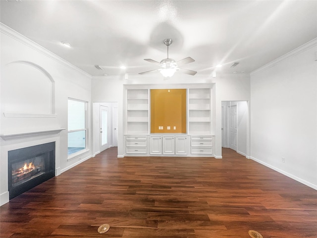 2424 Katy Hockley Cut Off Rd, Katy, TX 77493 - unfurnished living room with crown molding, baseboards, a ceiling fan, dark wood finished floors, and a glass covered fireplace