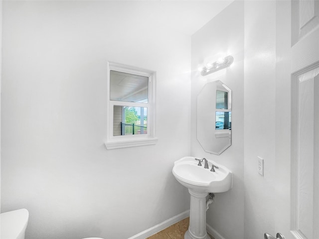 2424 Katy Hockley Cut Off Rd, Katy, TX 77493 - bathroom featuring toilet, baseboards, and tile patterned floors