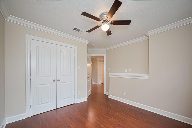 2409 Spears Dr, Humble, TX 77396 - unfurnished bedroom with dark wood-type flooring, ornamental molding, a closet, baseboards, and ceiling fan