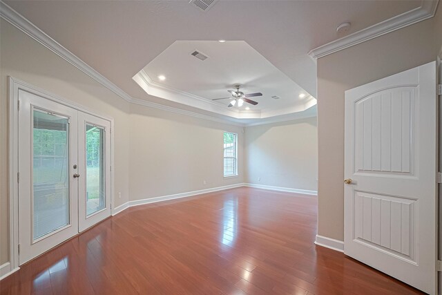 2409 Spears Dr, Humble, TX 77396 - empty room with crown molding, a tray ceiling, ceiling fan, french doors, and wood finished floors
