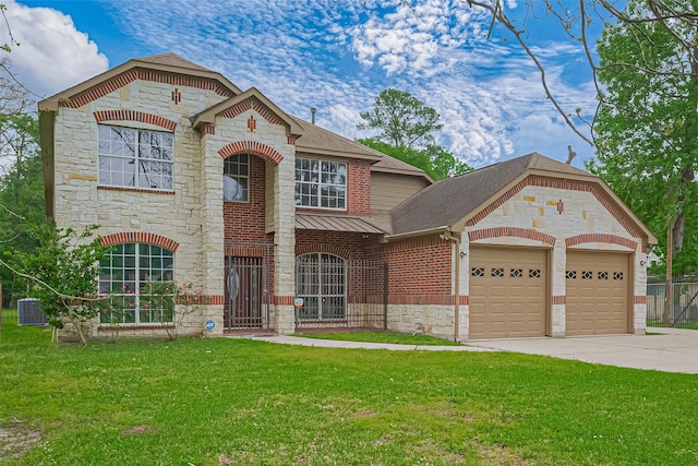 2409 Spears Dr, Humble, TX 77396 - french provincial home with stone siding, roof with shingles, an attached garage, brick siding, and driveway