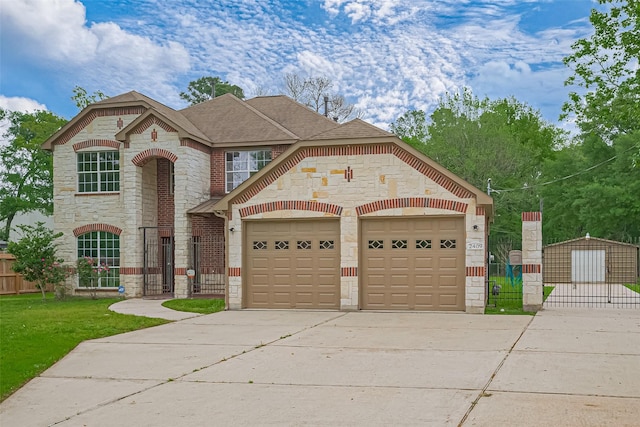 2409 Spears Dr, Humble, TX 77396 - french provincial home with stone siding, a gate, concrete driveway, and a shingled roof