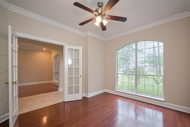 2409 Spears Dr, Humble, TX 77396 - empty room featuring french doors, wood finished floors, crown molding, and plenty of natural light