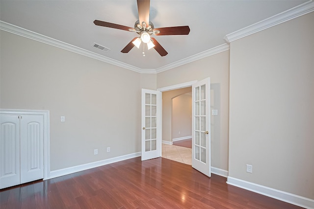 2409 Spears Dr, Humble, TX 77396 - spare room with french doors, a ceiling fan, crown molding, wood finished floors, and baseboards