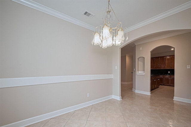 2409 Spears Dr, Humble, TX 77396 - empty room featuring ornamental molding, light tile patterned floors, baseboards, arched walkways, and a chandelier