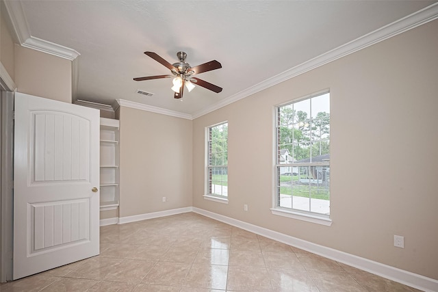 2409 Spears Dr, Humble, TX 77396 - unfurnished room featuring ornamental molding, plenty of natural light, ceiling fan, and baseboards