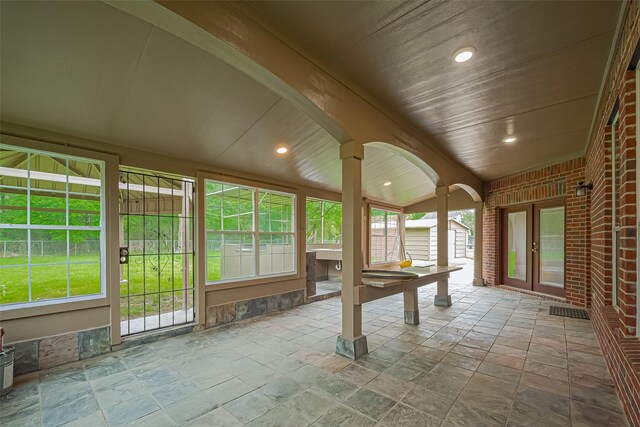 2409 Spears Dr, Humble, TX 77396 - unfurnished sunroom featuring stone tile floors, french doors, wooden ceiling, vaulted ceiling, and recessed lighting