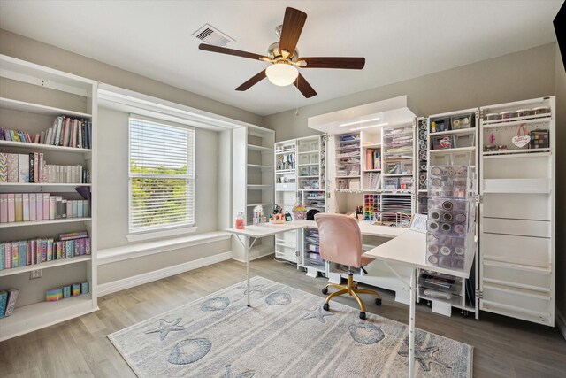1623 25th St, Dickinson, TX 77539 - office featuring a ceiling fan, wood finished floors, built in study area, and baseboards