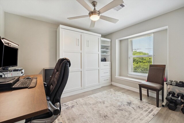 1623 25th St, Dickinson, TX 77539 - office area with light wood-type flooring, a ceiling fan, and baseboards