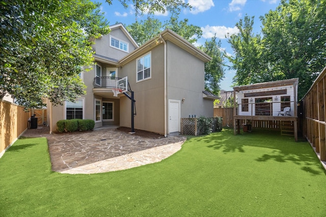 4012 Ruskin St, Houston, TX 77005 - back of property with a patio area, stucco siding, and a balcony