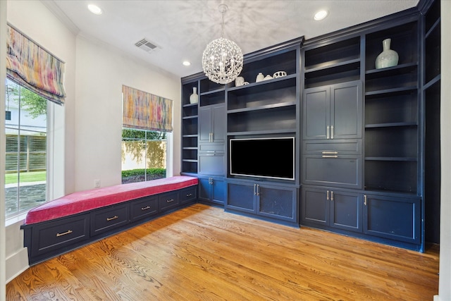 4012 Ruskin St, Houston, TX 77005 - unfurnished living room featuring a chandelier, light wood-style floors, recessed lighting, built in shelves, and crown molding