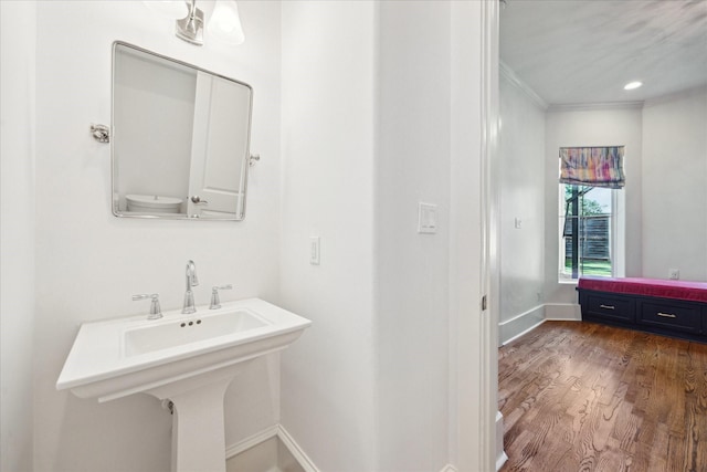 4012 Ruskin St, Houston, TX 77005 - bathroom with crown molding, baseboards, and wood finished floors