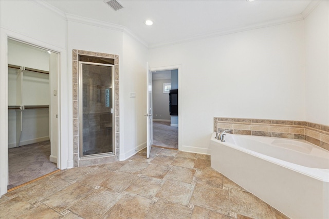 4012 Ruskin St, Houston, TX 77005 - bathroom with a spacious closet, a shower stall, crown molding, a garden tub, and stone finish flooring