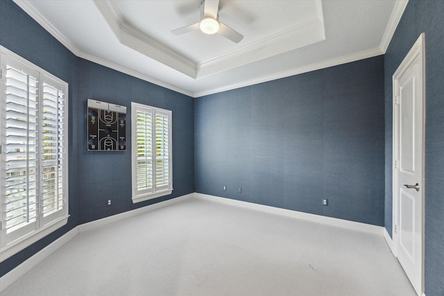 4012 Ruskin St, Houston, TX 77005 - carpeted empty room featuring ornamental molding, ceiling fan, a tray ceiling, and baseboards