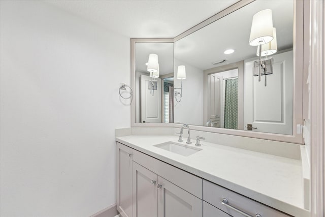 4012 Ruskin St, Houston, TX 77005 - bathroom with vanity, baseboards, and a shower with curtain