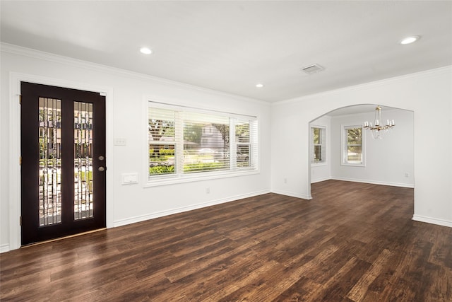 4030 Grennoch Ln, Houston, TX 77025 - entryway featuring a chandelier, crown molding, plenty of natural light, dark wood-style flooring, and baseboards