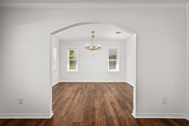 4030 Grennoch Ln, Houston, TX 77025 - unfurnished dining area featuring arched walkways, dark wood-style floors, a chandelier, ornamental molding, and baseboards