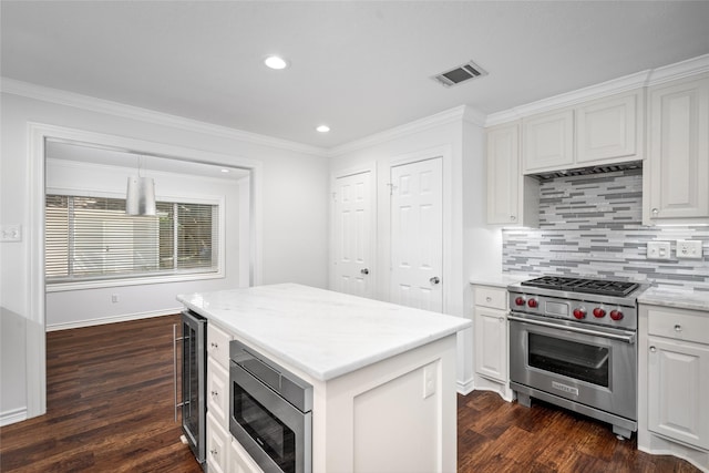 4030 Grennoch Ln, Houston, TX 77025 - kitchen featuring stainless steel appliances, wine cooler, dark wood finished floors, white cabinets, and backsplash