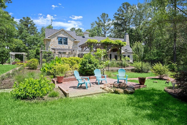 129 Stagecoach Cir, Huntsville, TX 77340 - back of house featuring stone siding, a patio, and a chimney