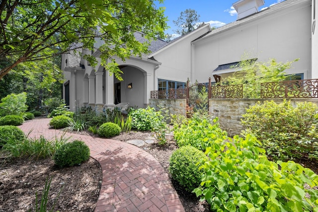 129 Stagecoach Cir, Huntsville, TX 77340 - property entrance featuring stucco siding and stone siding