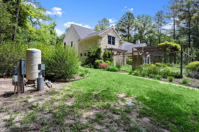 129 Stagecoach Cir, Huntsville, TX 77340 - view of side of home featuring stone siding and a lawn