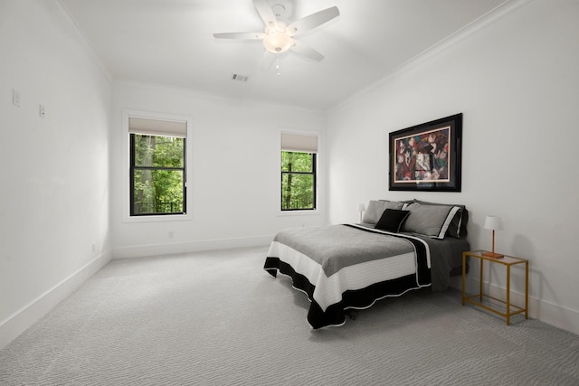 129 Stagecoach Cir, Huntsville, TX 77340 - bedroom featuring crown molding, multiple windows, baseboards, carpet floors, and a ceiling fan