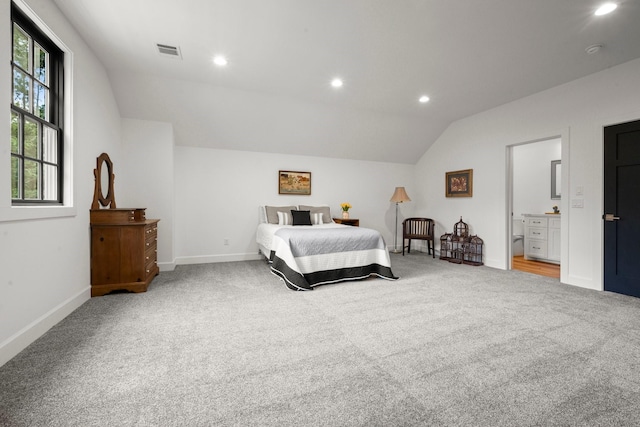 129 Stagecoach Cir, Huntsville, TX 77340 - bedroom featuring lofted ceiling, carpet, recessed lighting, baseboards, and ensuite bathroom