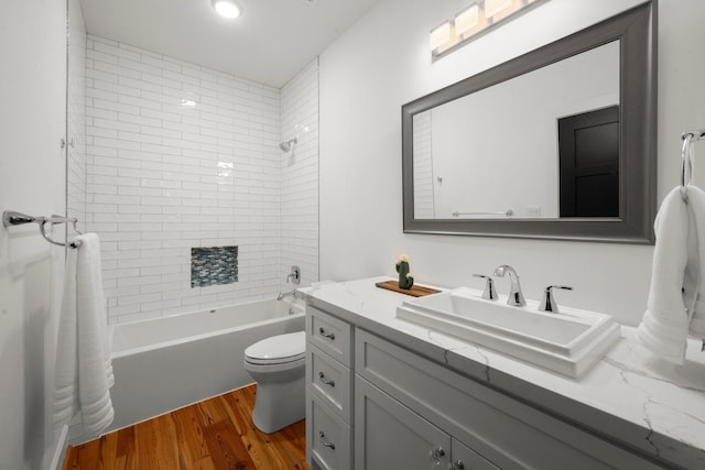 129 Stagecoach Cir, Huntsville, TX 77340 - full bath featuring wood finished floors, toilet, shower / bath combination, and vanity