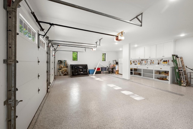 129 Stagecoach Cir, Huntsville, TX 77340 - garage featuring a garage door opener
