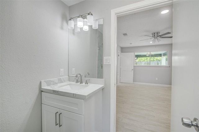 4614 Wee Lassie Ln, Houston, TX 77084 - bathroom featuring ceiling fan, vanity, and baseboards