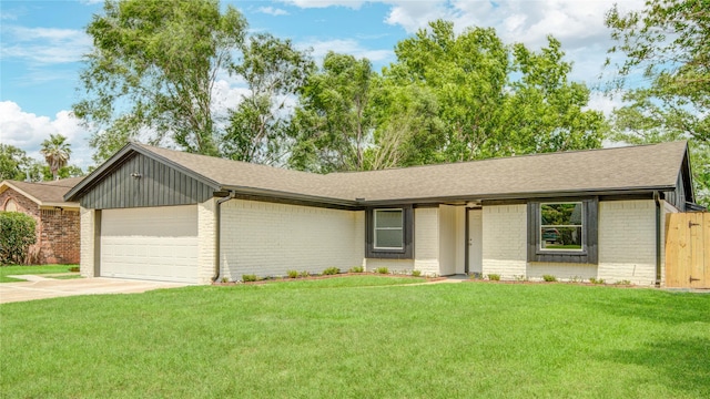 4614 Wee Lassie Ln, Houston, TX 77084 - ranch-style house with brick siding, an attached garage, concrete driveway, and roof with shingles