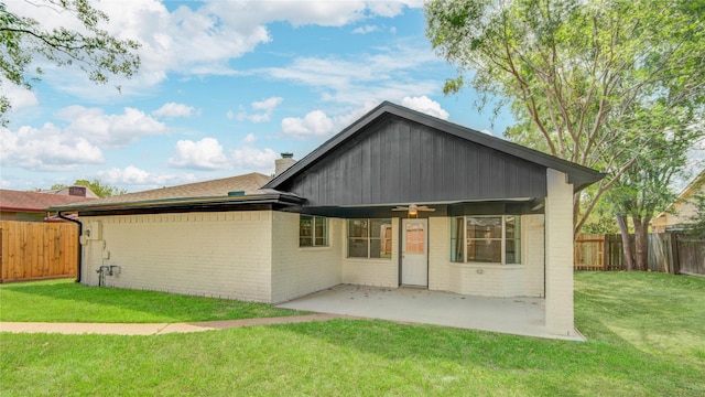 4614 Wee Lassie Ln, Houston, TX 77084 - back of property with brick siding, a ceiling fan, a patio area, and a chimney