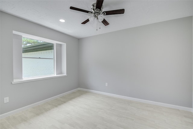 4614 Wee Lassie Ln, Houston, TX 77084 - unfurnished room with a ceiling fan, recessed lighting, baseboards, and light wood finished floors