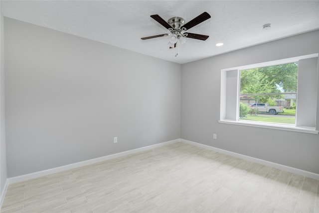 4614 Wee Lassie Ln, Houston, TX 77084 - empty room with light wood finished floors, ceiling fan, baseboards, recessed lighting, and a smoke detector