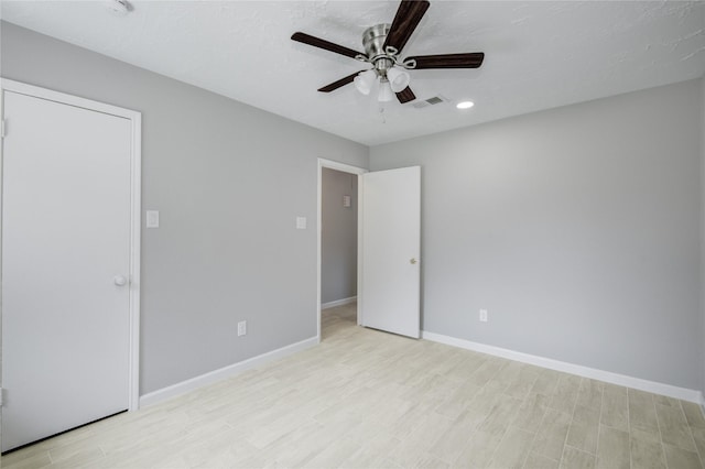 4614 Wee Lassie Ln, Houston, TX 77084 - unfurnished bedroom with light wood finished floors, baseboards, recessed lighting, and ceiling fan