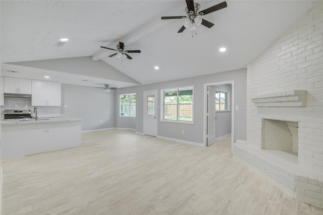 4614 Wee Lassie Ln, Houston, TX 77084 - unfurnished living room featuring ceiling fan, baseboards, light wood-style floors, a fireplace, and recessed lighting