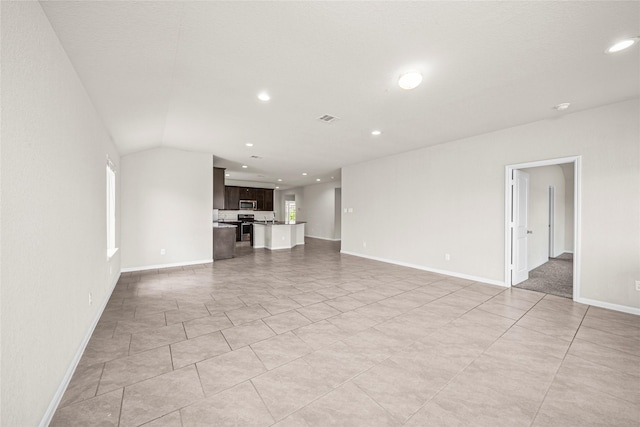 29618 Juntti Park Ct, Katy, TX 77494 - unfurnished living room with recessed lighting, baseboards, and light tile patterned floors