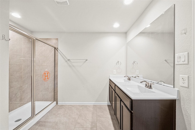 29618 Juntti Park Ct, Katy, TX 77494 - full bath with a shower stall, tile patterned flooring, double vanity, recessed lighting, and baseboards