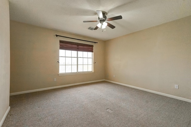 4415 April Meadow Way, Sugar Land, TX 77479 - spare room with carpet flooring, baseboards, a ceiling fan, and a textured ceiling